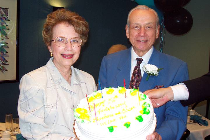 Mom and Dad with anniversary cake